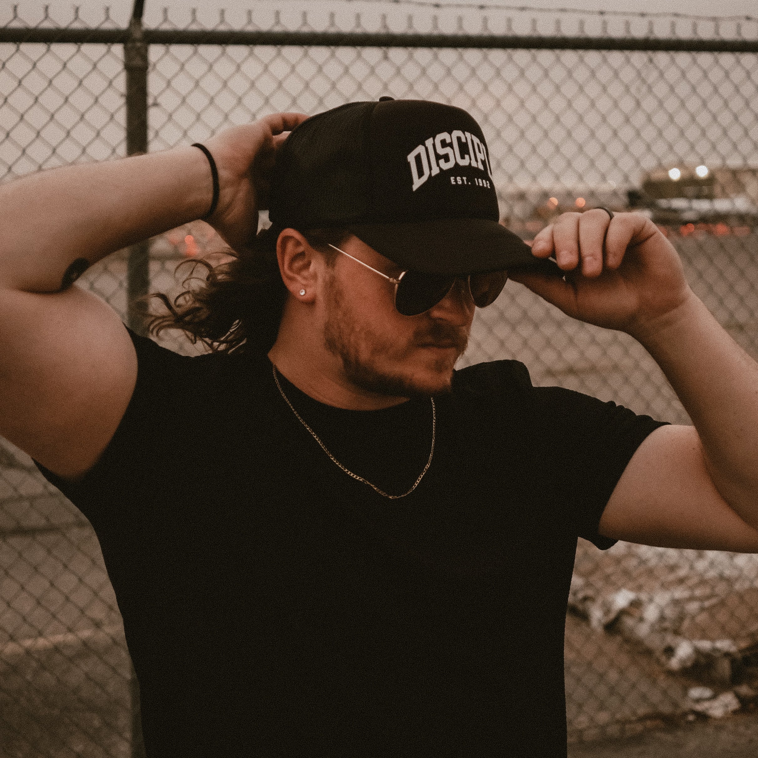 Collegiate Arch Trucker Hat