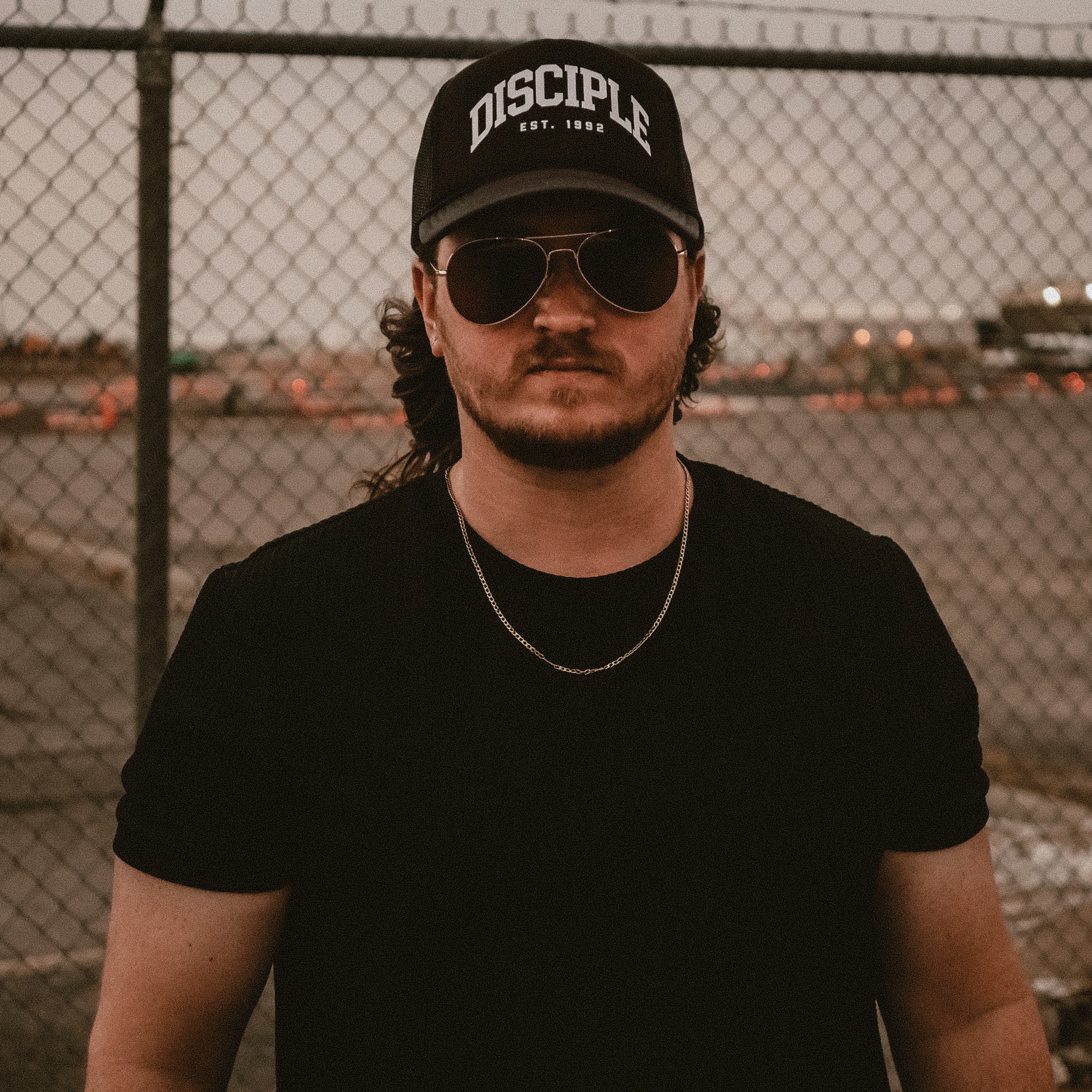 Collegiate Arch Trucker Hat